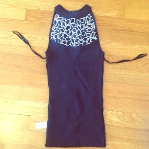 Black tank sweater with white embellished neckline